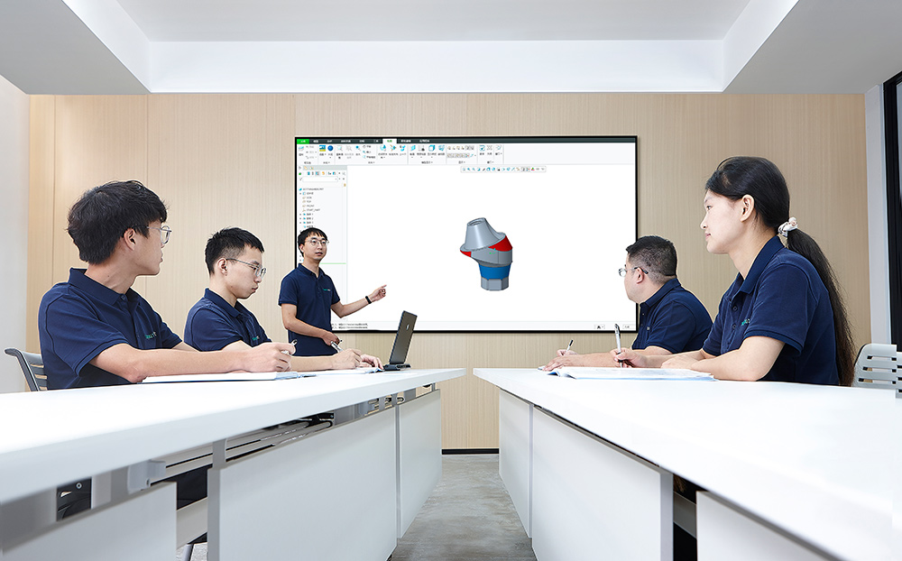 Trusyou research and development team reviewing a dental implant component